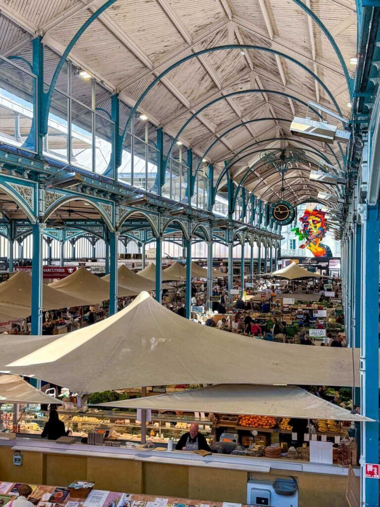 Morning scene at Les Halles market in Dijon with local vendors