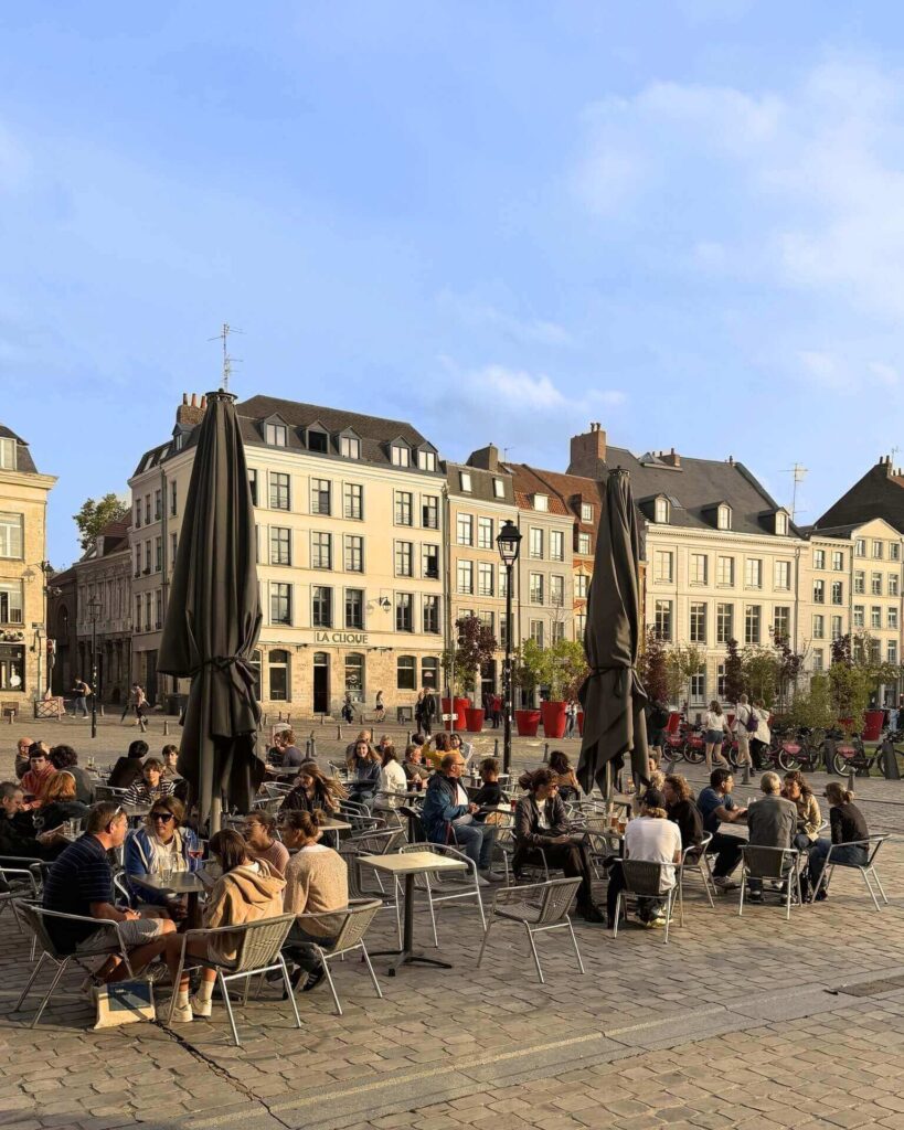 Outdoor café in Lille Old Town with people sitting and relaxing