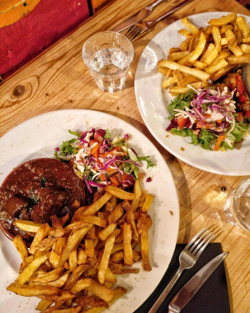 Traditional dishes in Lille including carbonnade flamande and moules frites