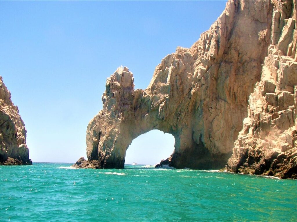  Crystal clear turquoise water and rocky coastline at Cabo San Lucas Mexico