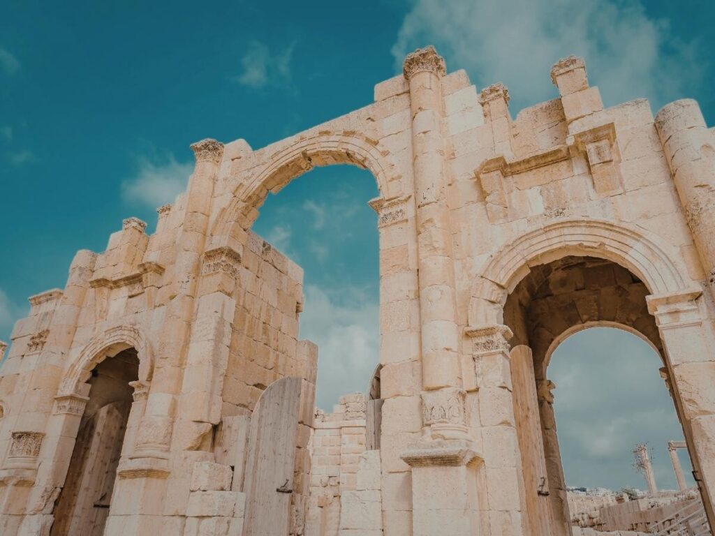 Ancient ruins of Ephesus with marble columns under a clear blue sky in Turkey