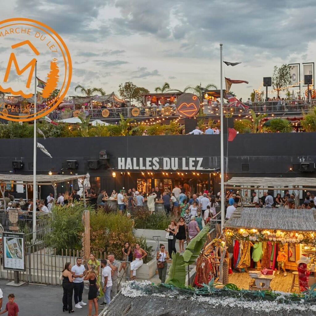 Food stalls and people at Marché du Lez Montpellier