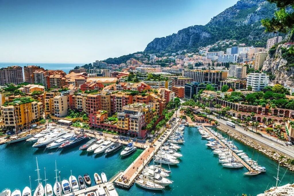 Monaco harbor filled with yachts and coastal buildings