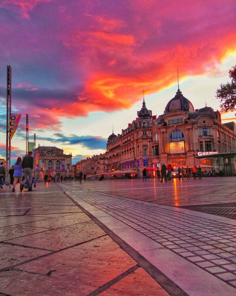 Evening street in Montpellier with cafés and warm light