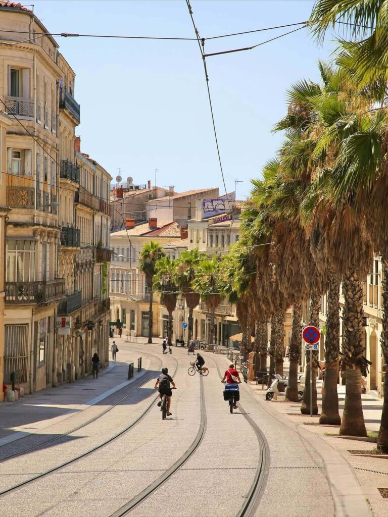 Narrow streets in Montpellier old town with balconies and evening lights