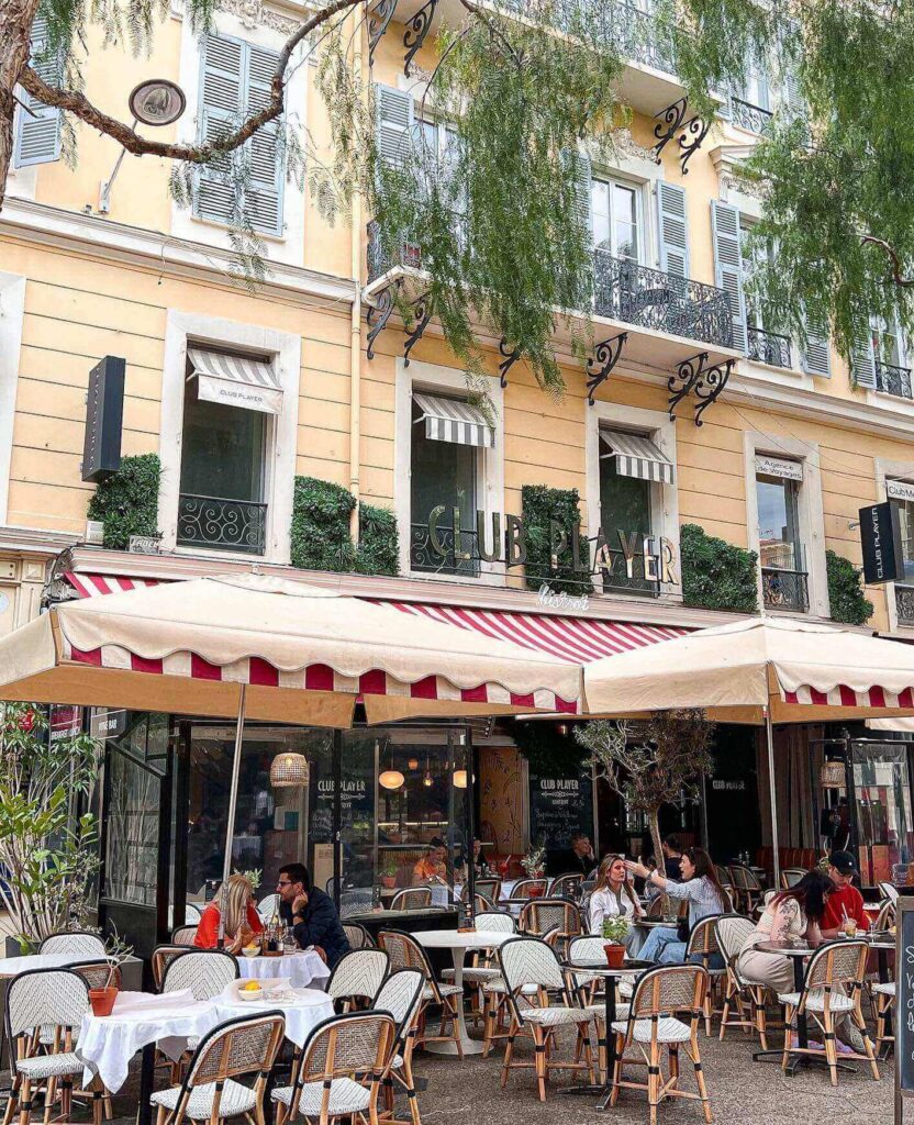 People sitting at a café in Nice during a relaxed evening