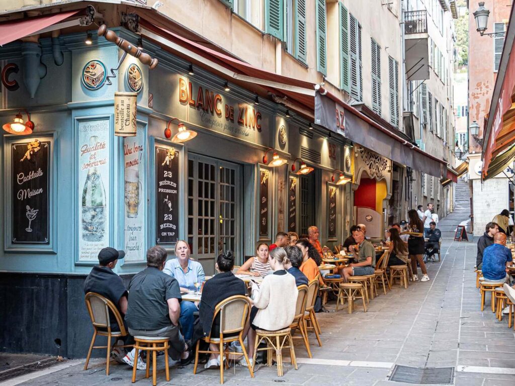Outdoor cafés in Old Town Nice during evening