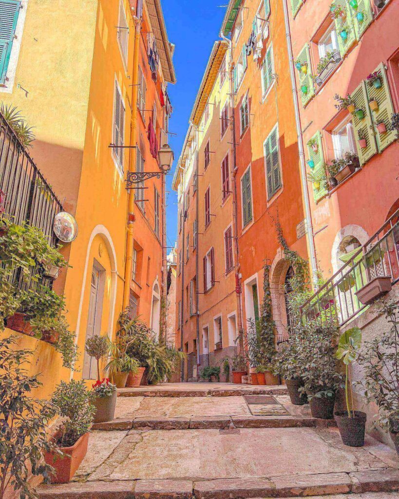 Narrow streets of Old Town Nice with cafés and evening lights