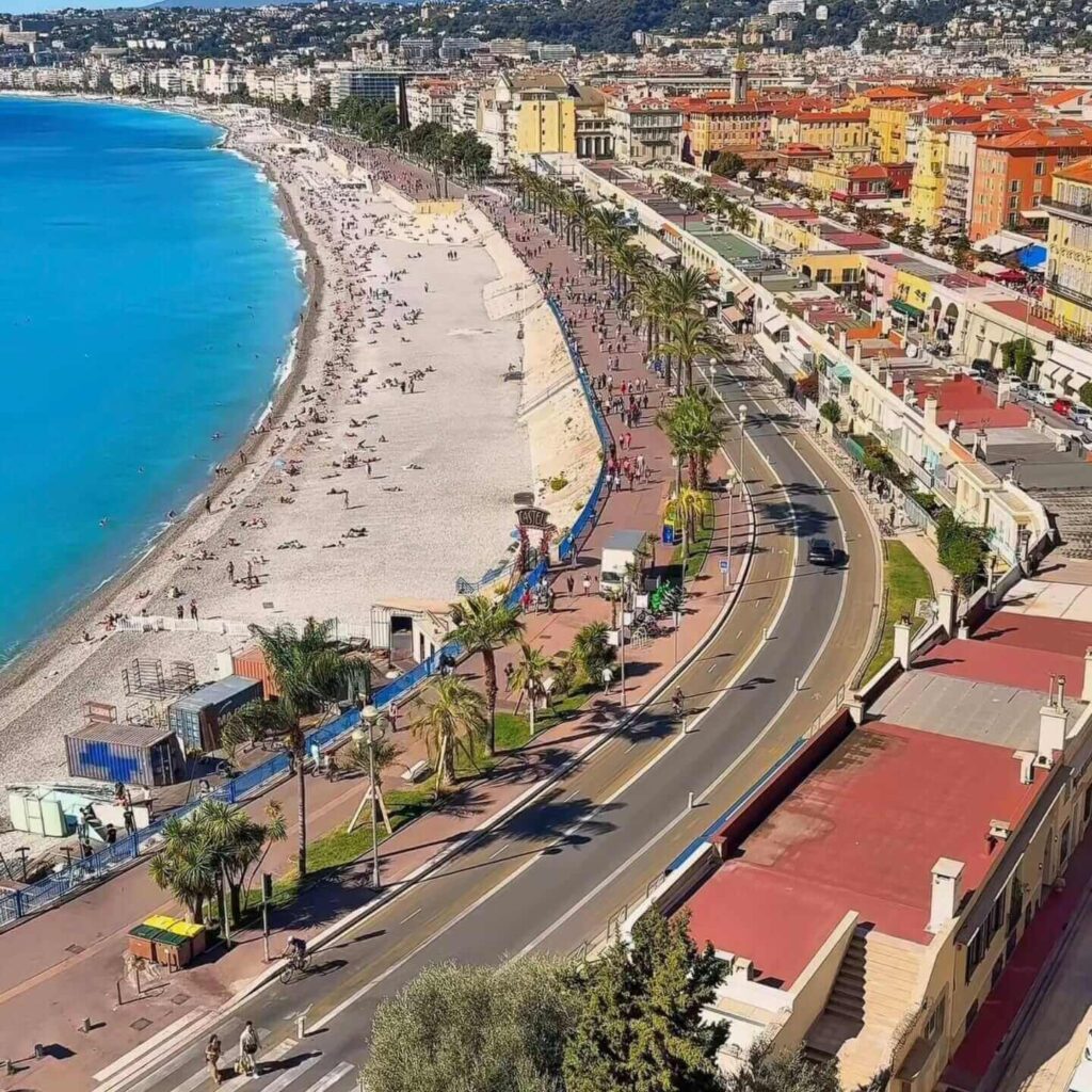 Crowds walking along the Promenade des Anglais in Nice during summer