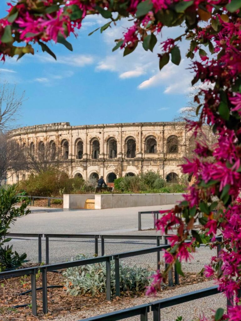 Roman arena in Nîmes near Montpellier with people walking around