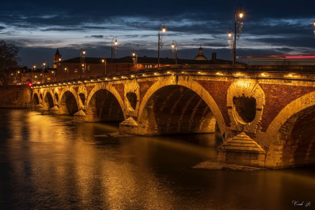 Sunset view from Pont Neuf bridge in Toulouse over the Garonne River