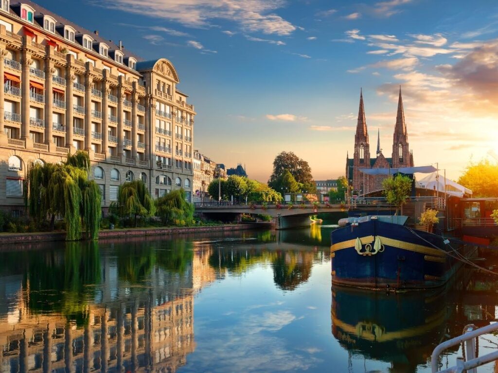Sunset over Strasbourg canals and historic buildings