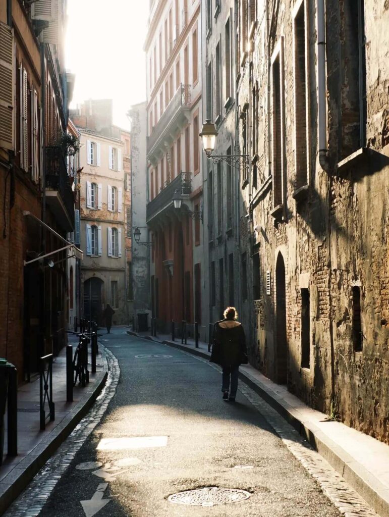 Quiet street in Toulouse during golden hour capturing a slow travel moment
