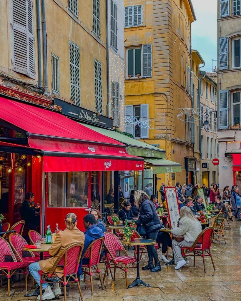 Outdoor café in Aix-en-Provence with people sitting and enjoying coffee