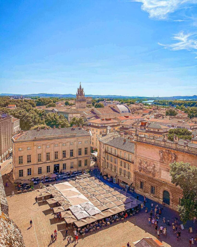 Charming narrow streets in Avignon Old Town with cafés and shops
