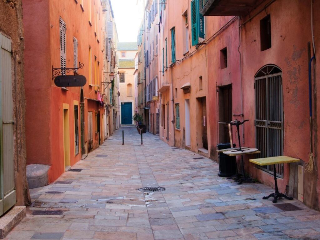 Narrow stone streets in Bastia Citadel with historic buildings and soft light