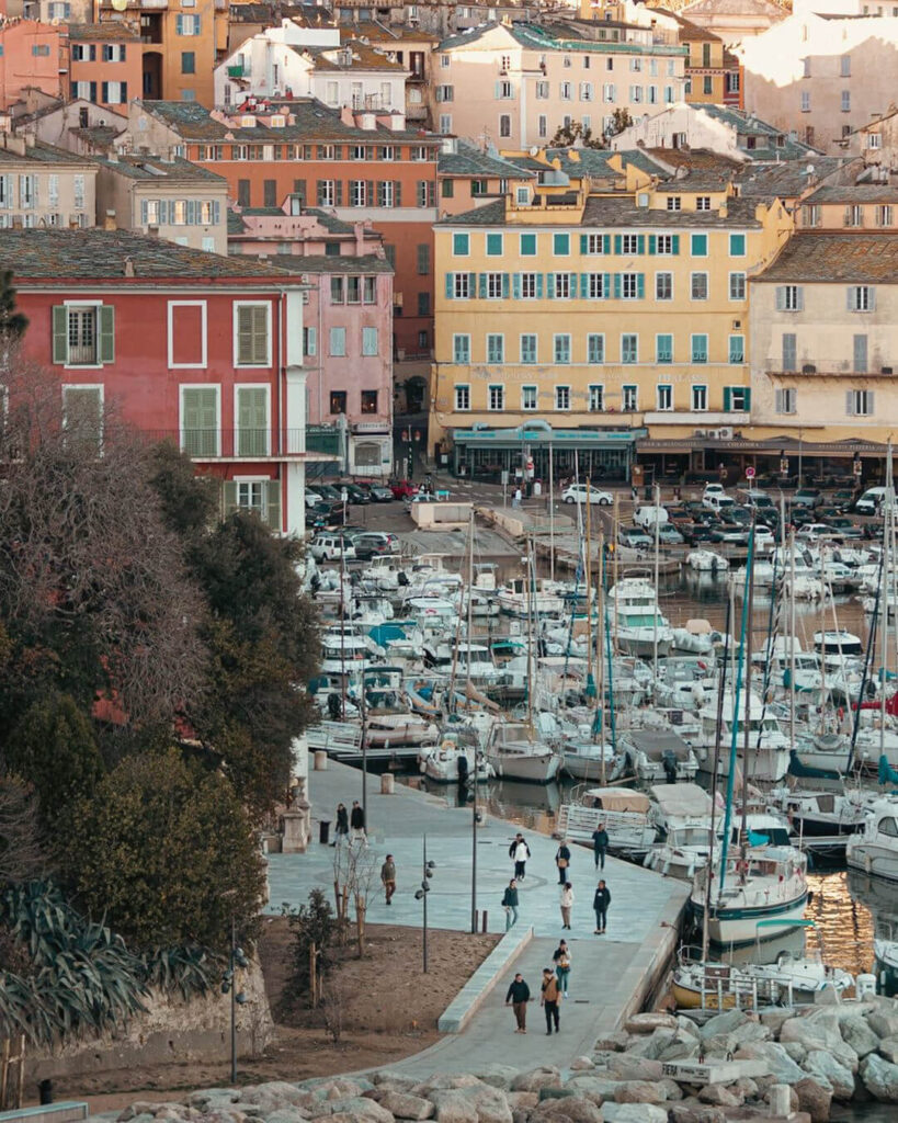 Ferry arriving at Bastia port with city buildings visible along the waterfront