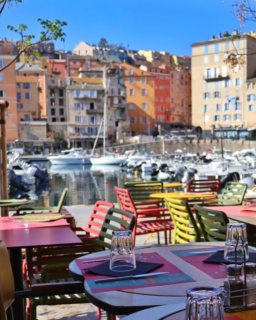 Local restaurant in Bastia with outdoor seating during evening dining hours