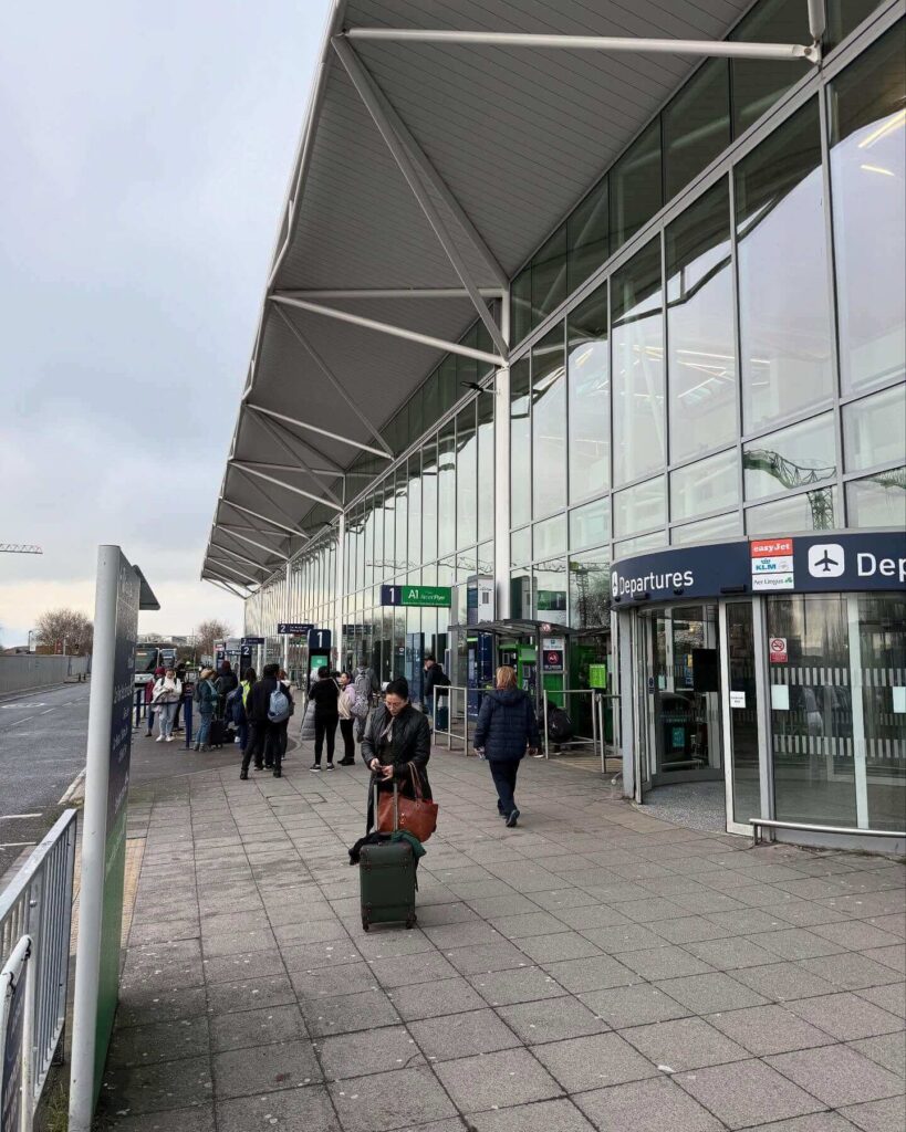 Exterior of Bastia Poretta Airport with entrance and surrounding landscape