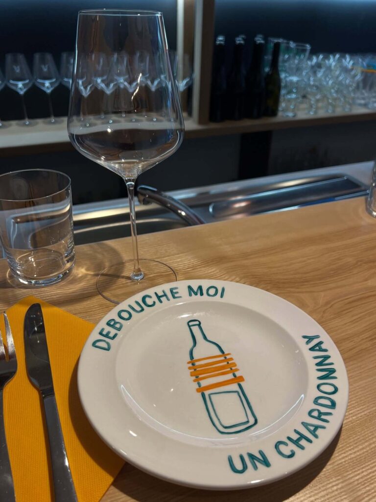 Wine tasting room in Beaune with bottles and glasses arranged for tasting