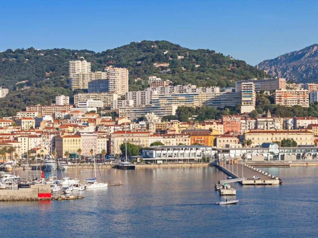 Overview of Ajaccio with harbor, old town, and Mediterranean coastline