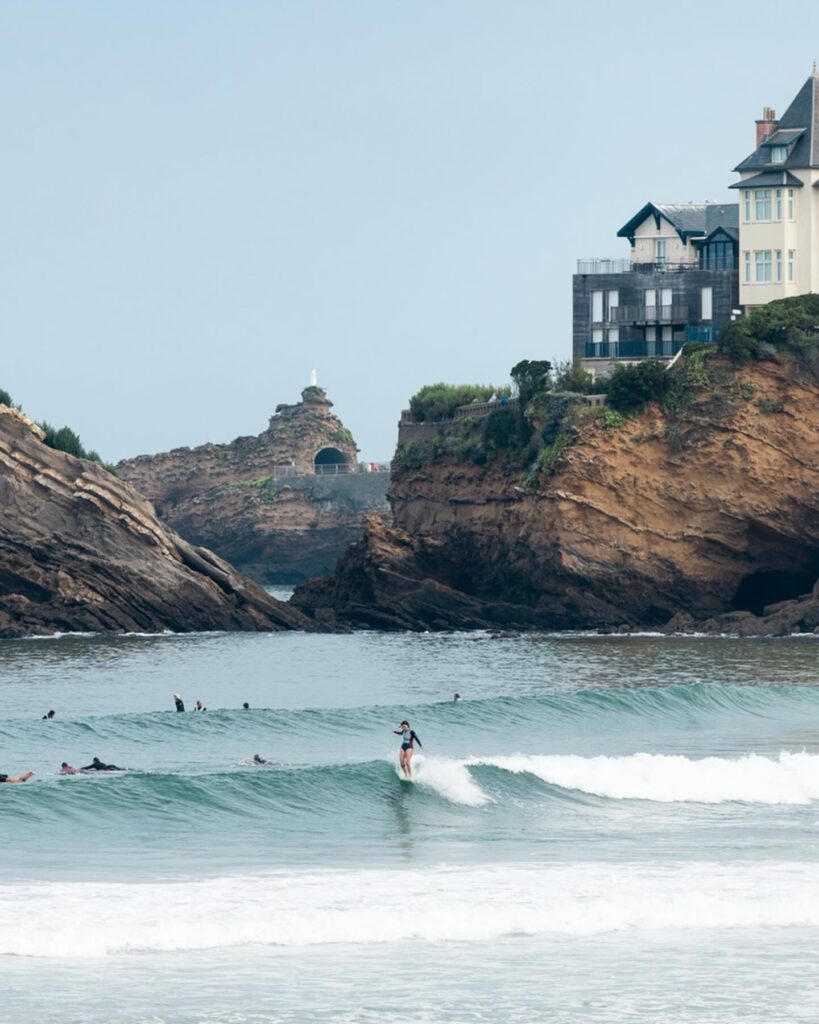 Surfers heading into the water in Biarritz