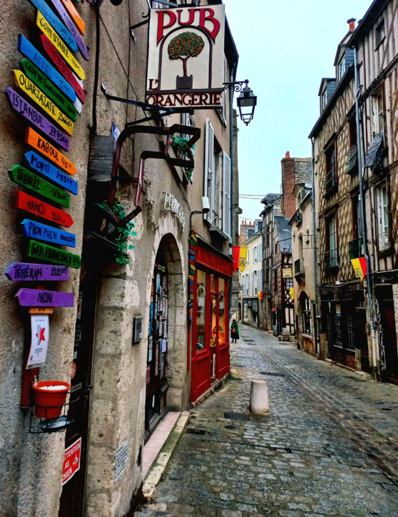 Street in Blois old town with hotels and cafes