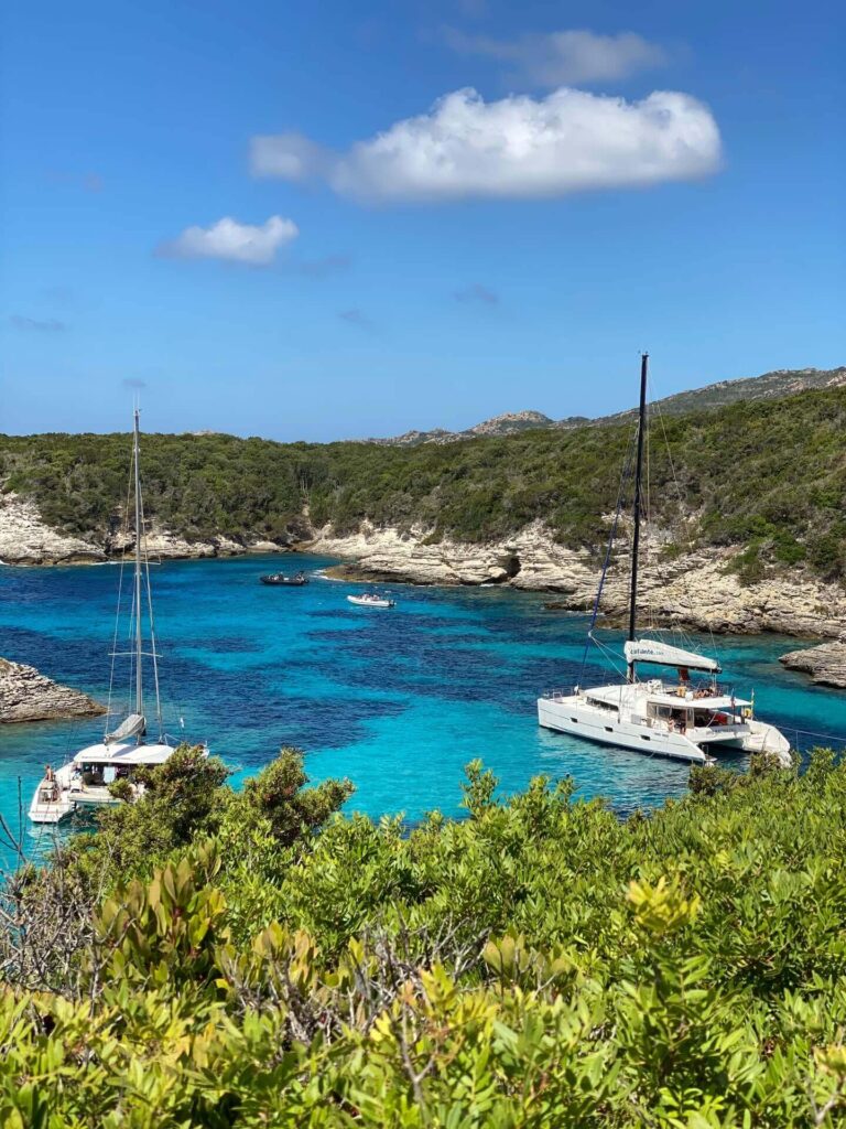 Clear water and sandy beach near Bonifacio during the afternoon