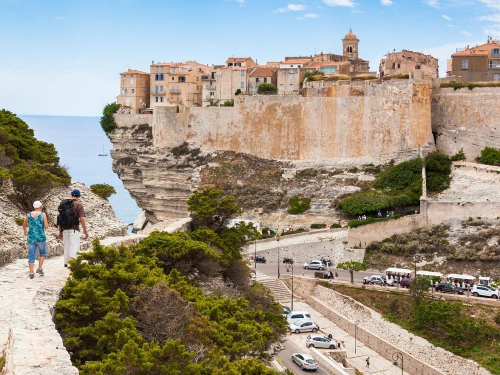 Houses perched on the edge of Bonifacio cliffs overlooking the sea