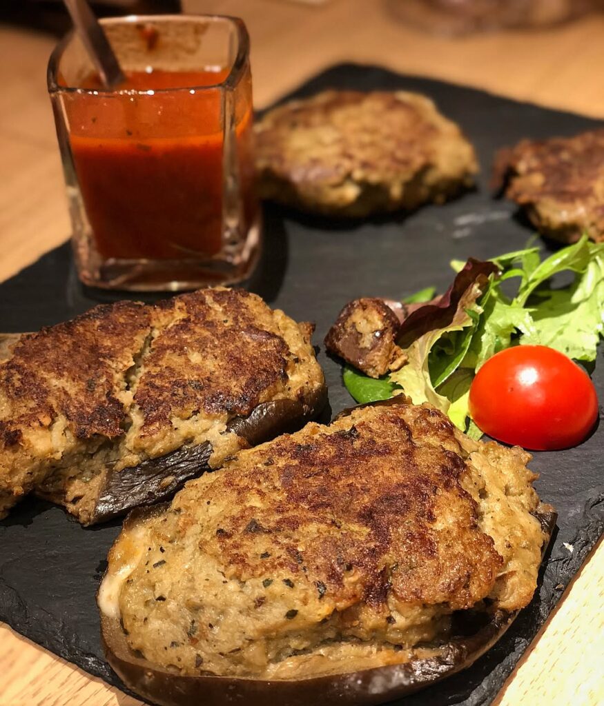 Outdoor dining at Bonifacio marina with local Corsican dishes