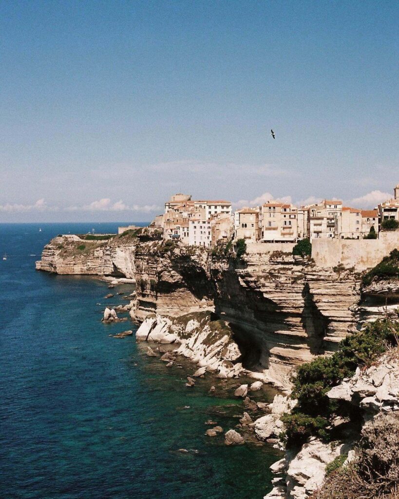 Wide view of Bonifacio cliffs, old town, and surrounding sea