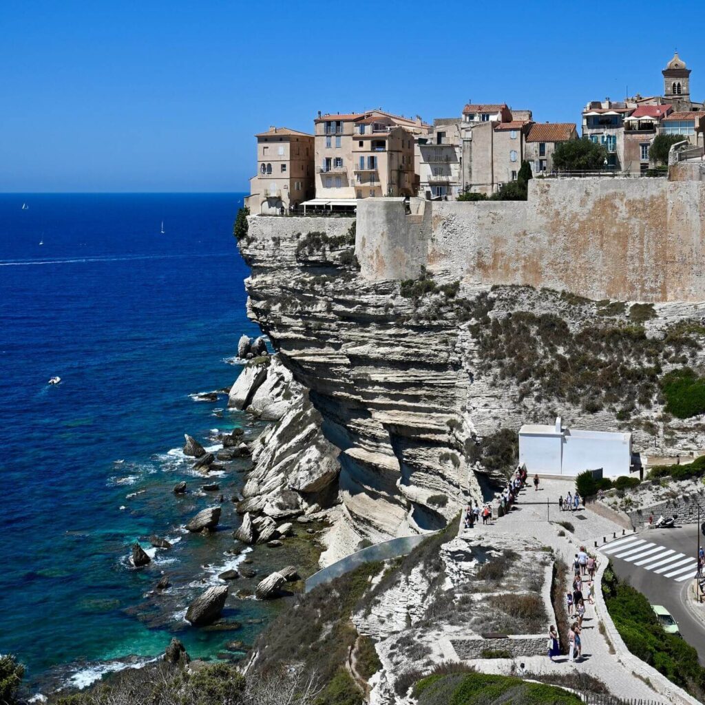 Walking along Bonifacio cliffs with sunny weather and uneven paths