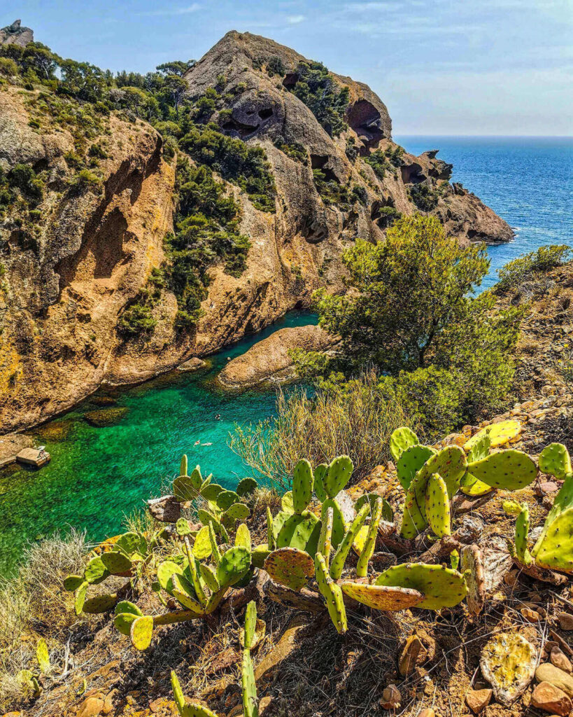 Calanque de Figuerolles with rocky cliffs surrounding a small cove