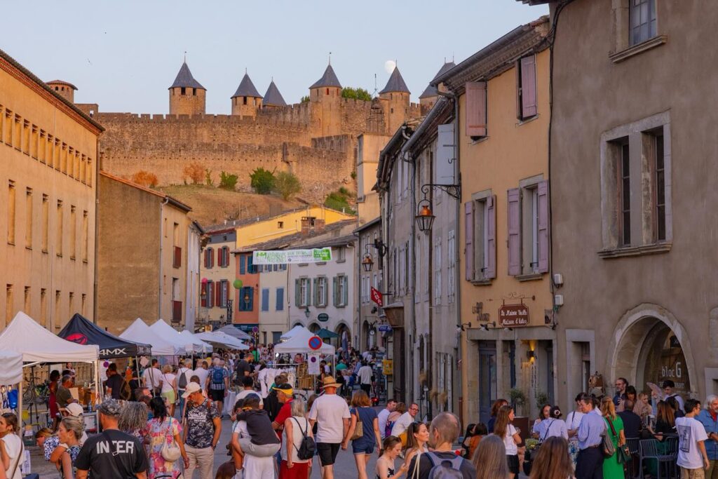 Local market in Carcassonne with fresh produce and food stalls