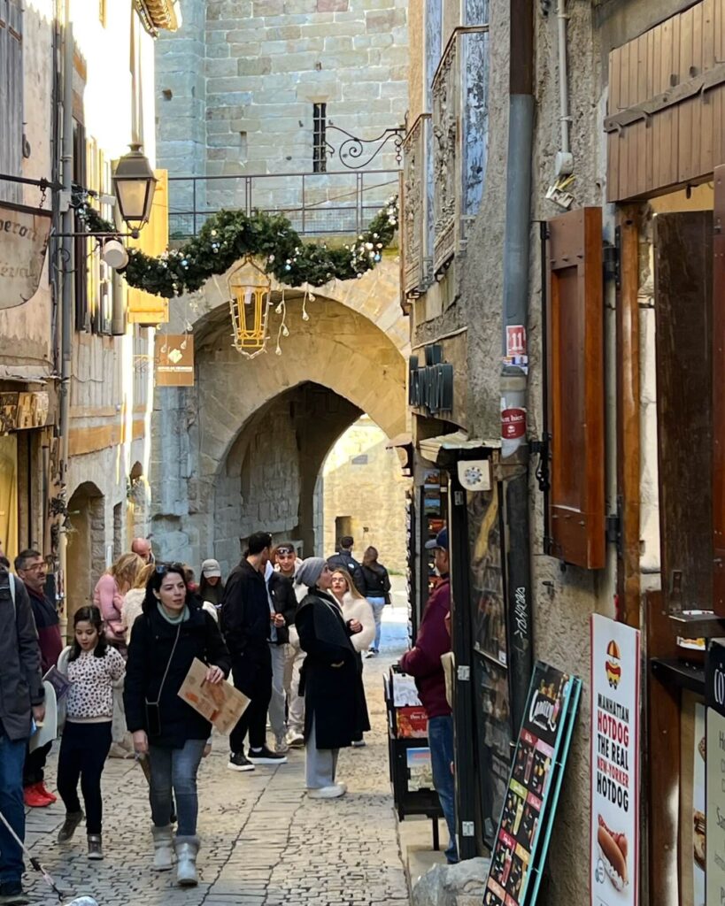 Busy streets in Carcassonne during peak daytime hours