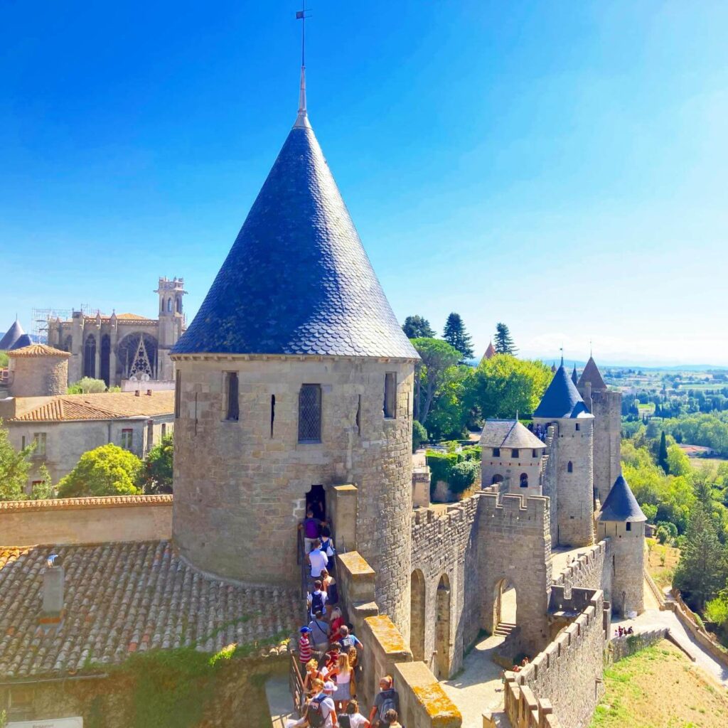 Crowded streets inside Carcassonne during peak daytime hours