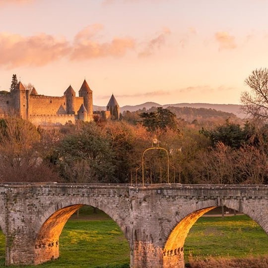 Carcassonne medieval walls at sunset with warm evening light