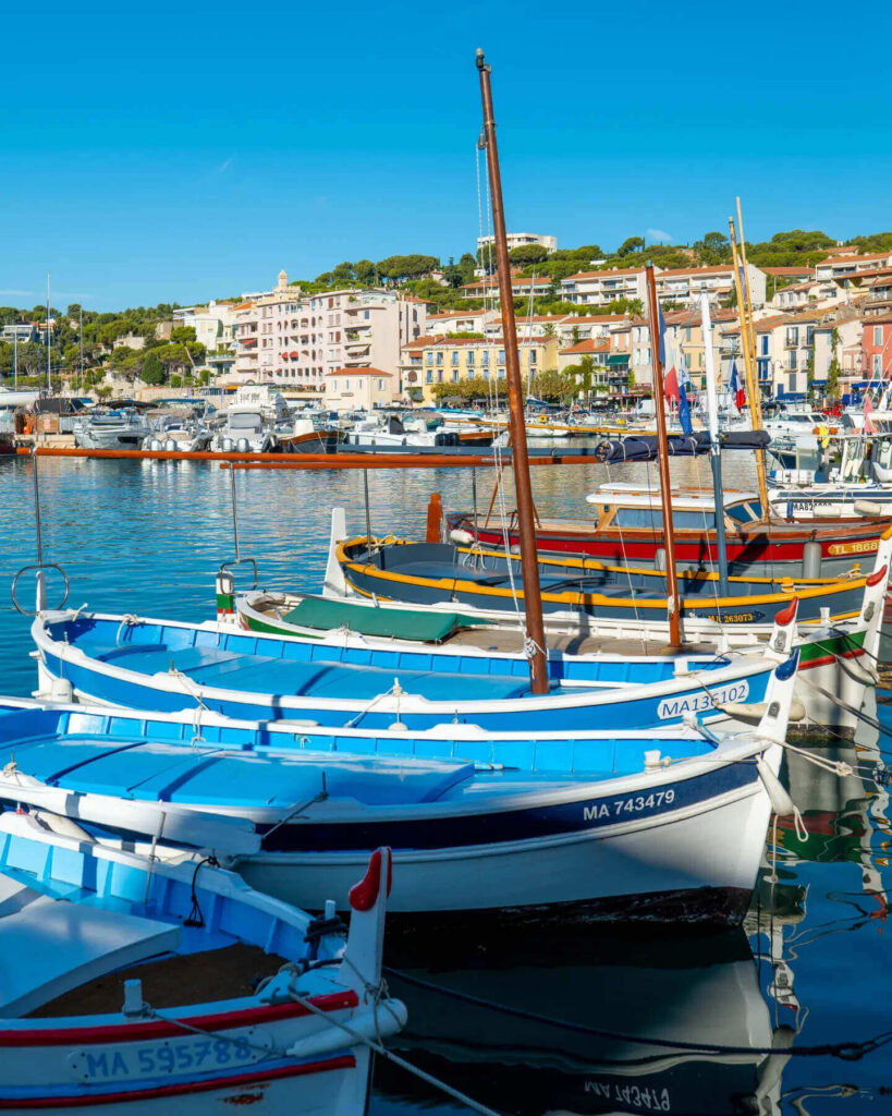 Calm morning at Cassis harbor with boats and quiet waterfront
