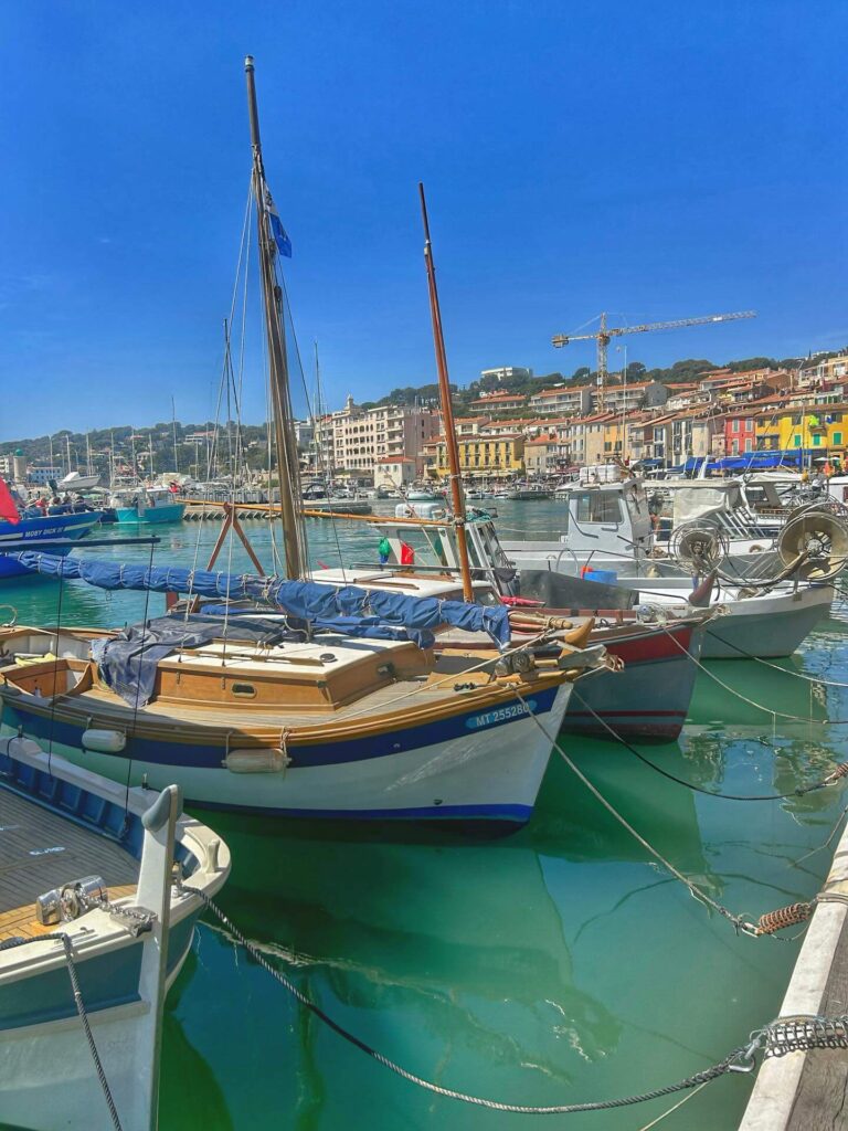 Sunset in Cassis with golden light over the harbor and coastline