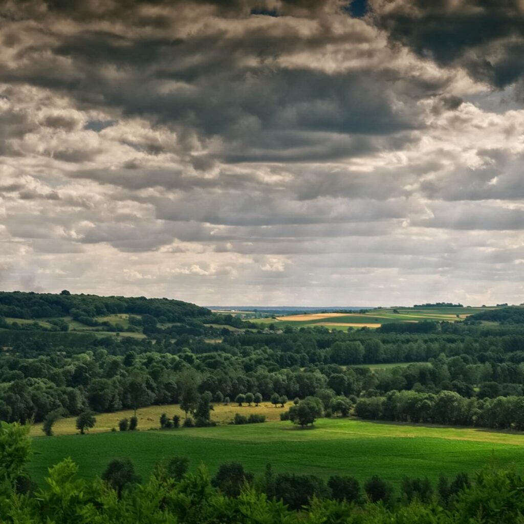 Sunset view of Chinon with fortress and river in warm evening light