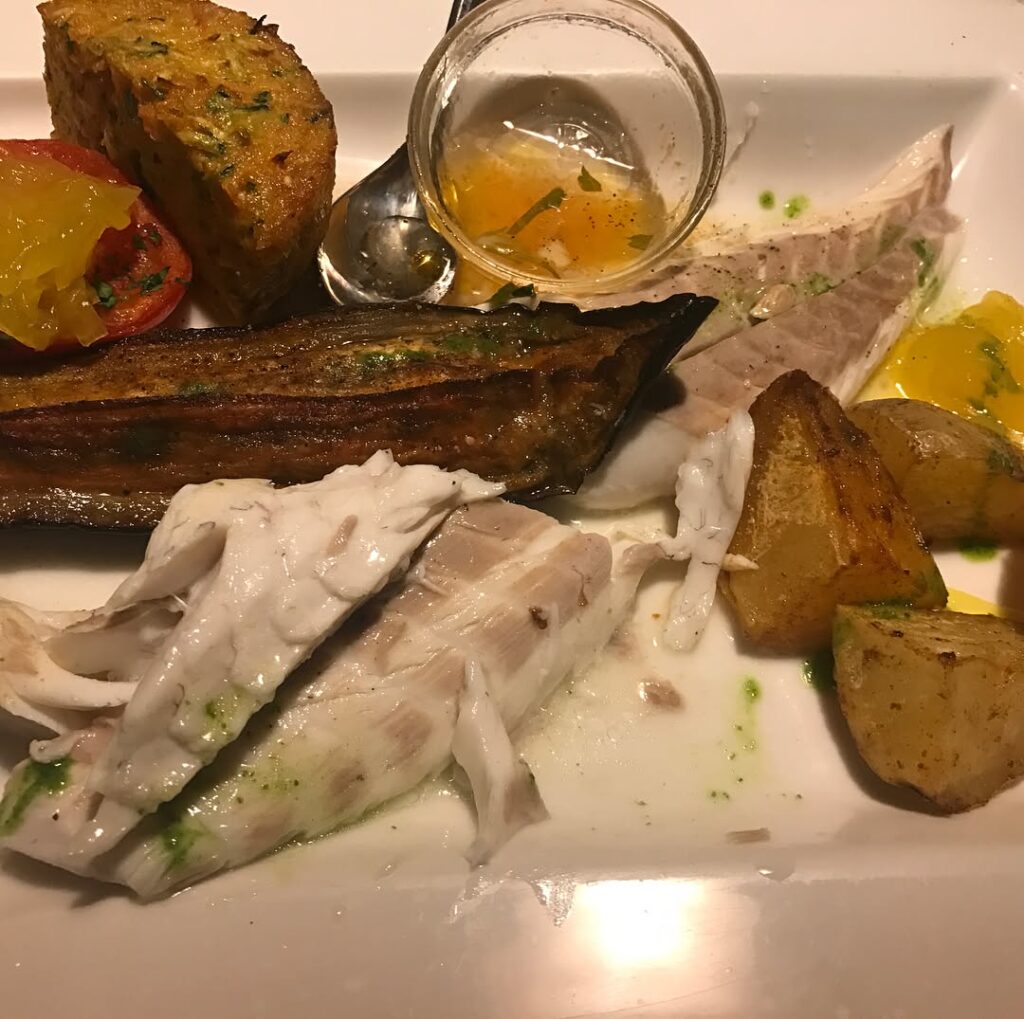 Traditional Corsican food including figatellu sausage and brocciu cheese