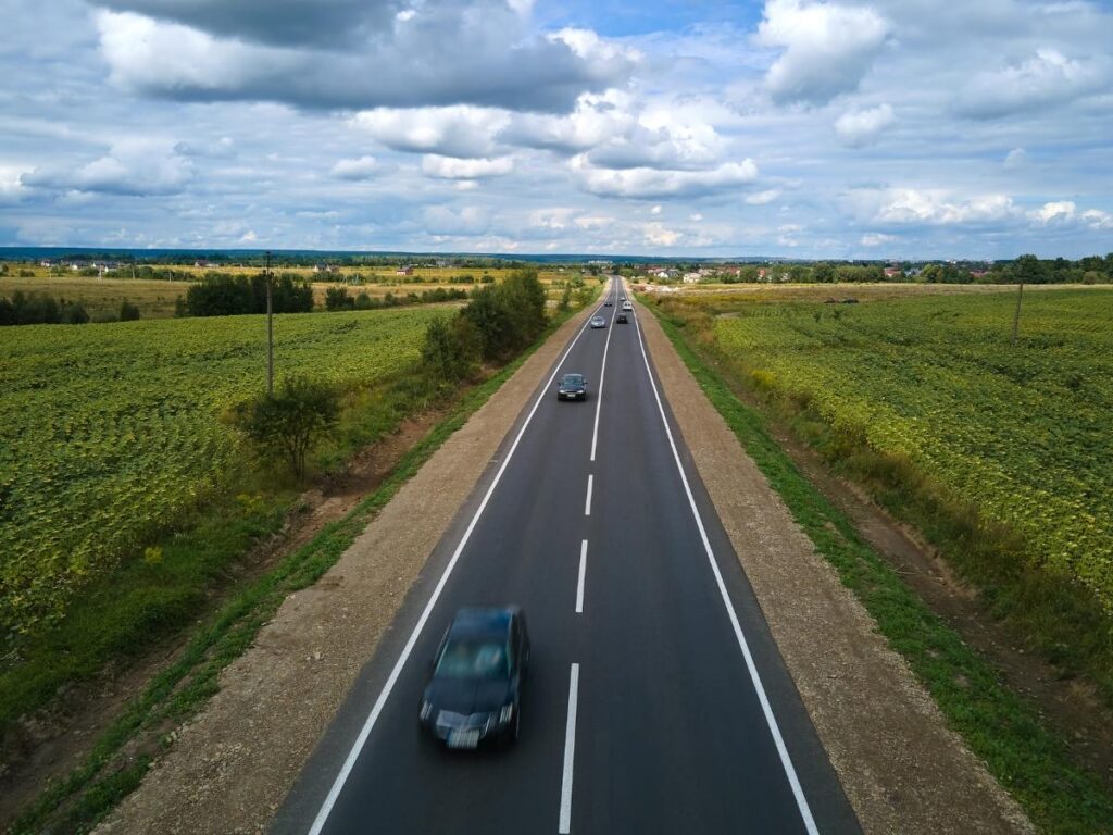Driving through Normandy countryside toward Étretat