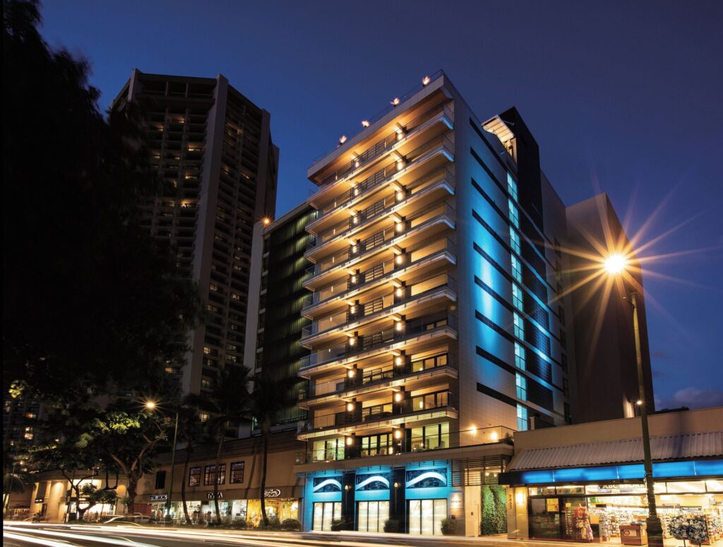 Exterior view of ESPACIO The Jewel of Waikiki in Honolulu, featuring ultra-luxury suites, modern architecture, rooftop ocean views, and exclusive Waikiki beachfront surroundings.