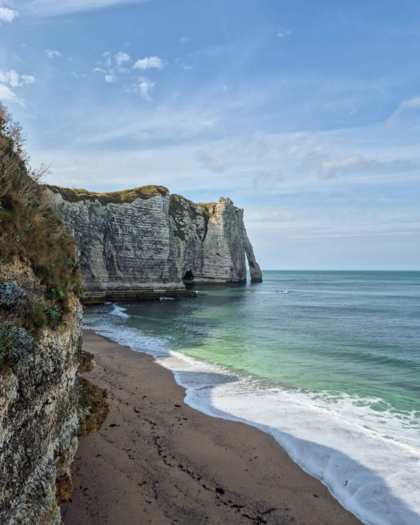 Walking along uneven cliff paths in Étretat