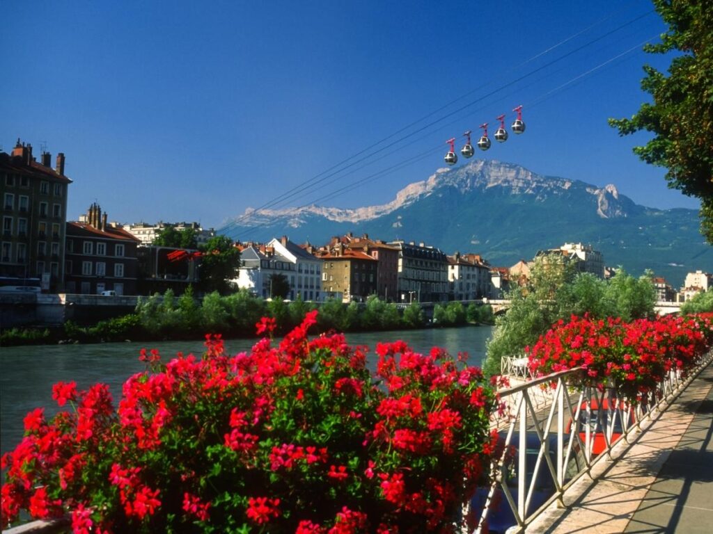 Grenoble city with green mountains during spring