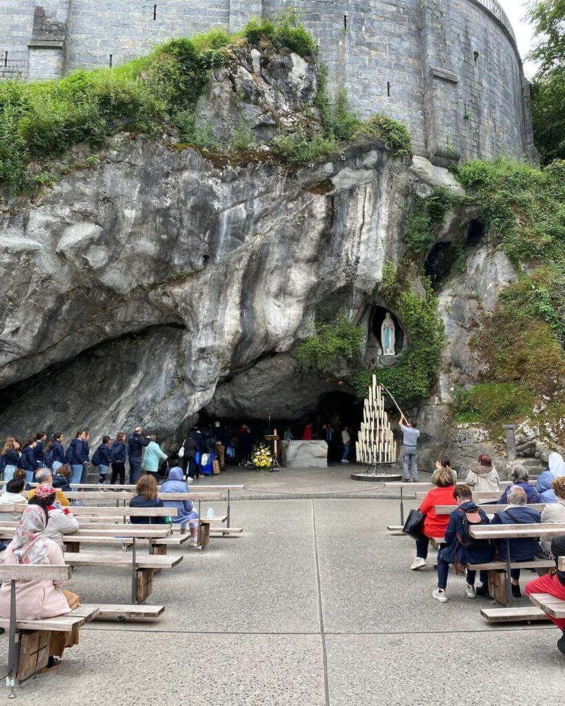 Visitors gathered quietly at the Grotto of Massabielle in Lourdes