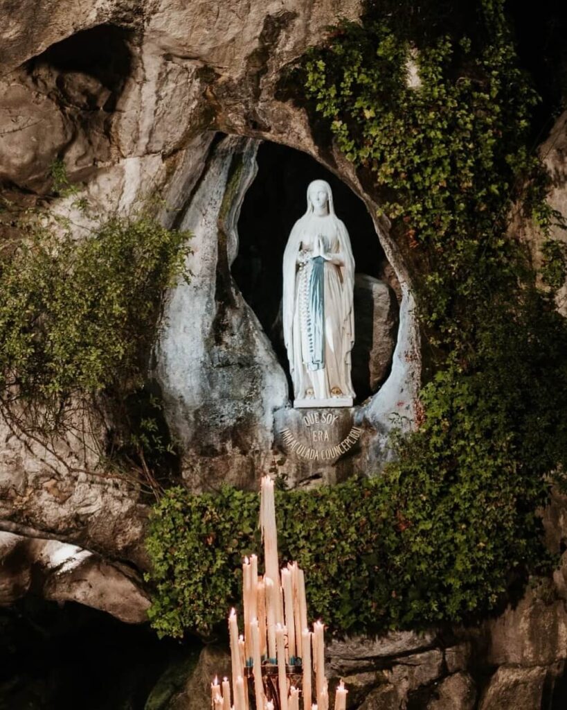 Visitors gathered quietly at the Grotto of Massabielle in Lourdes