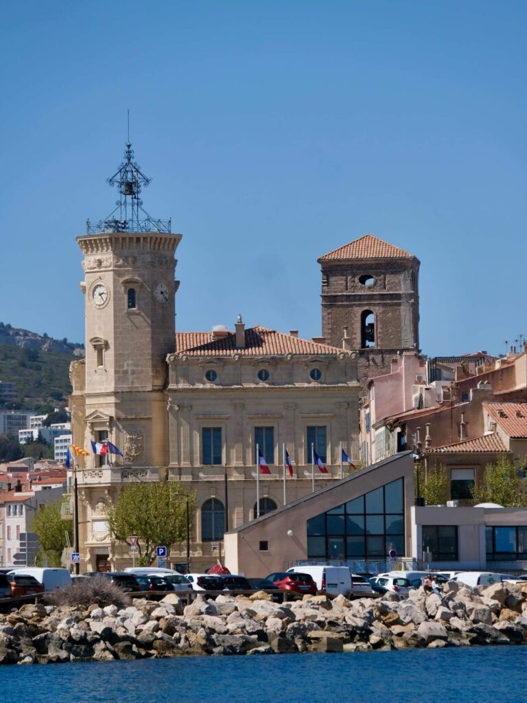 View of La Ciotat showing coastline, cliffs, and town together
