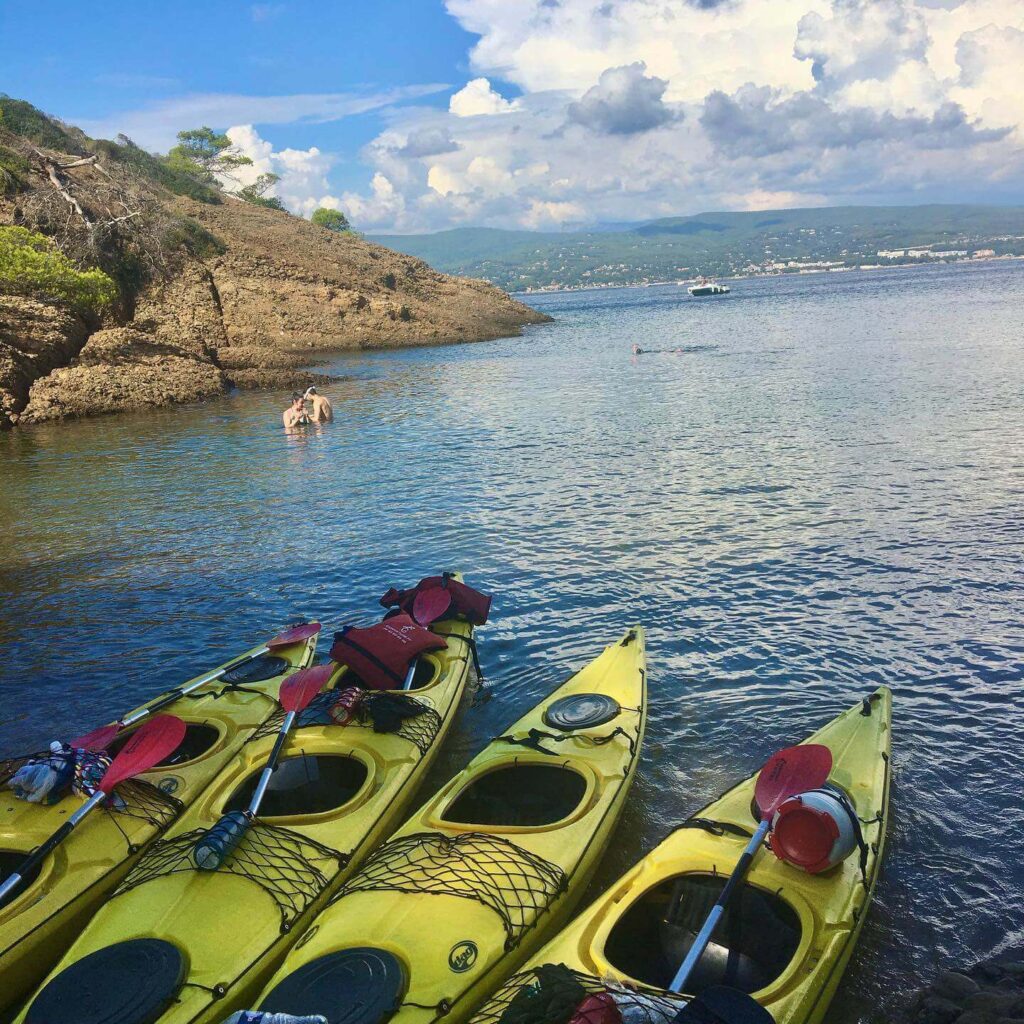Kayaking along the La Ciotat coastline with cliffs and clear water