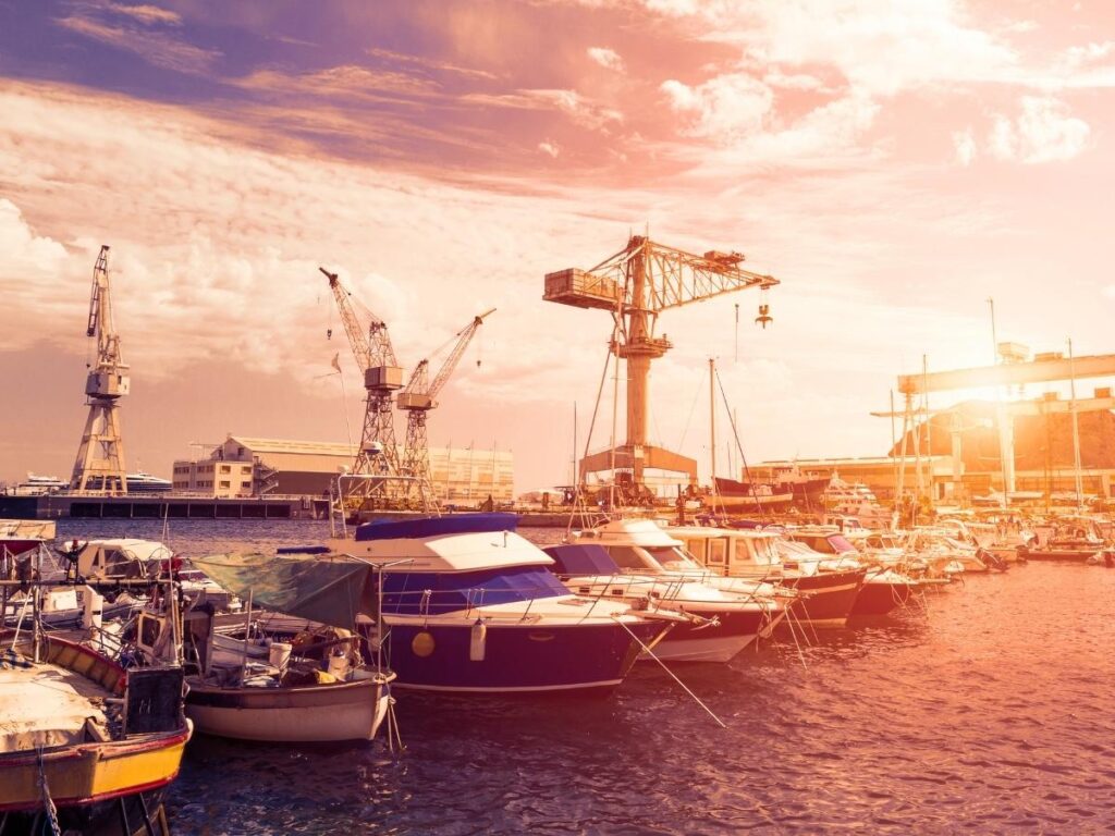 Sunset over the La Ciotat waterfront with warm light on the sea